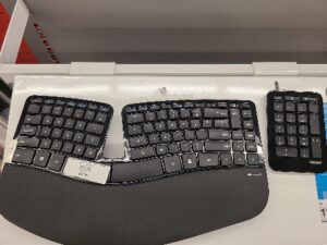 A keyboard on a desk Description automatically generated with medium confidence