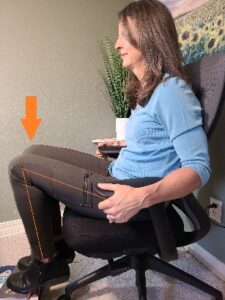 A person sitting in a chair Description automatically generated